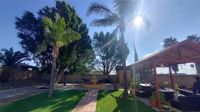 view of yard featuring a patio area and a gazebo