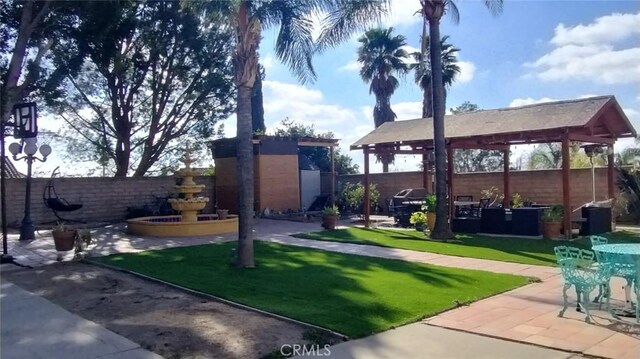 view of yard featuring a patio area and a gazebo