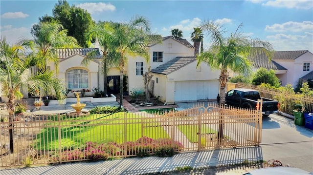 view of front of house featuring a garage and a front lawn