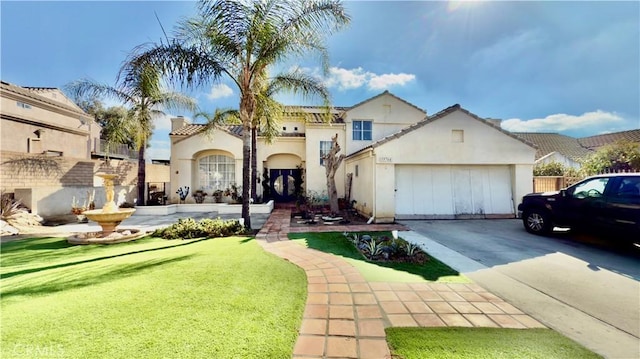 view of front facade with a garage and a front lawn