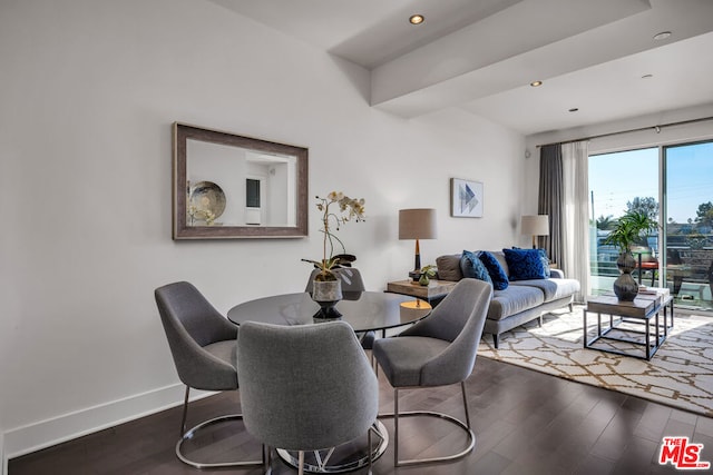 dining space with dark hardwood / wood-style floors