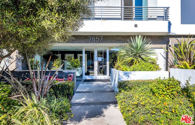 doorway to property with french doors and a balcony