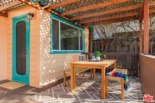 exterior space featuring a pergola and a deck