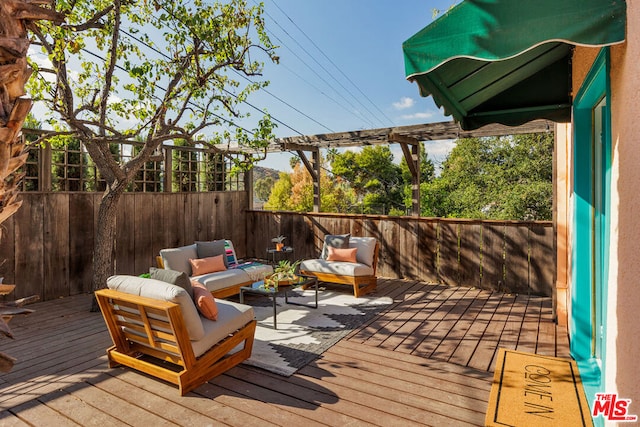 wooden deck featuring an outdoor living space