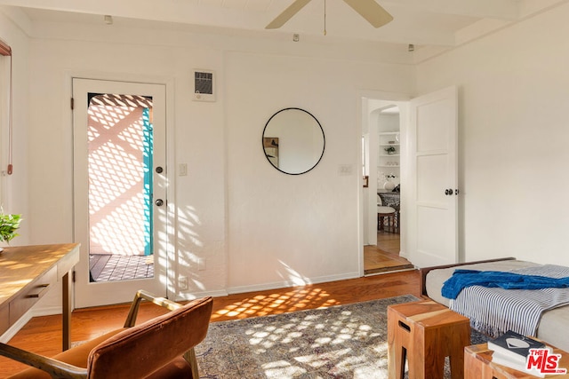 bedroom with wood-type flooring and ceiling fan