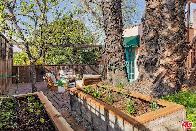 wooden terrace featuring an outdoor hangout area