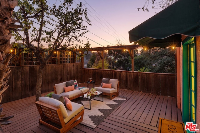 deck at dusk featuring an outdoor hangout area