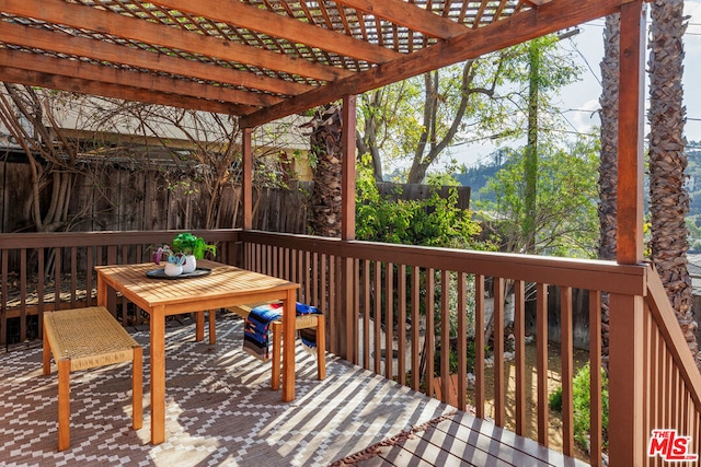 wooden deck with a pergola