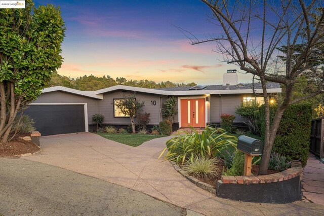 ranch-style home featuring a garage