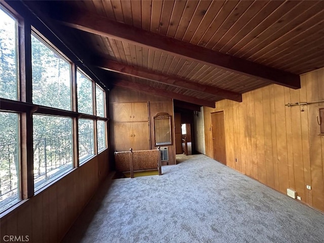 interior space featuring wood ceiling, vaulted ceiling with beams, and wooden walls