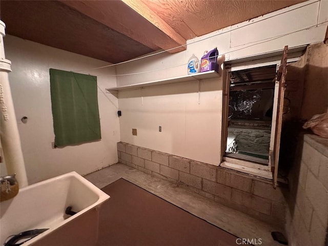 interior space with laundry area and a sink