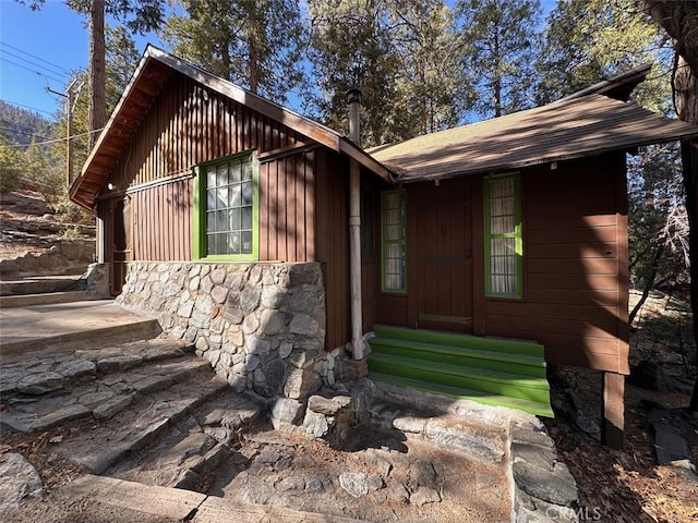 view of home's exterior with stone siding