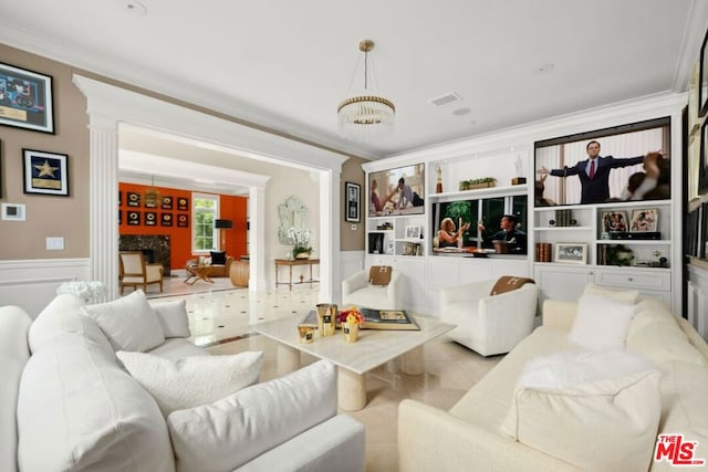 living room with ornamental molding and an inviting chandelier