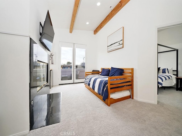 carpeted bedroom with access to exterior and beamed ceiling