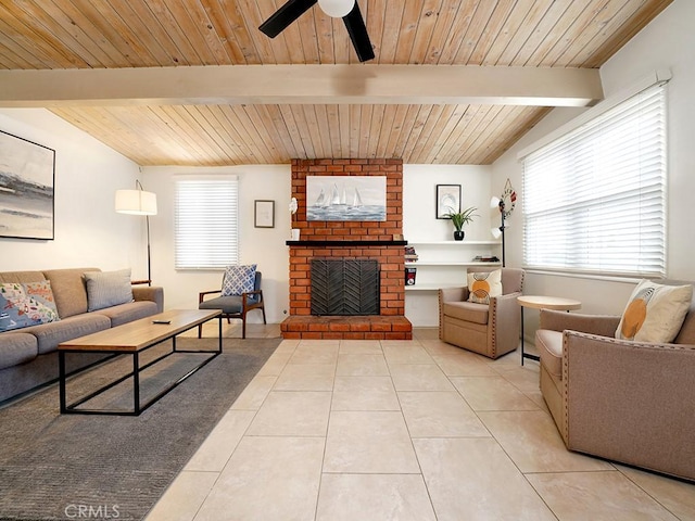 living room featuring light tile patterned floors, wood ceiling, and a fireplace