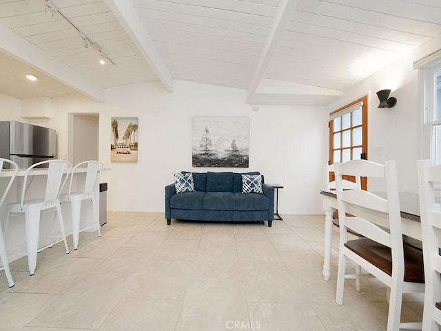 living room featuring wooden ceiling, rail lighting, and vaulted ceiling with beams