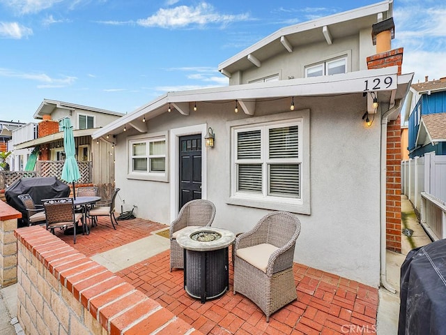 view of patio / terrace featuring an outdoor fire pit and area for grilling