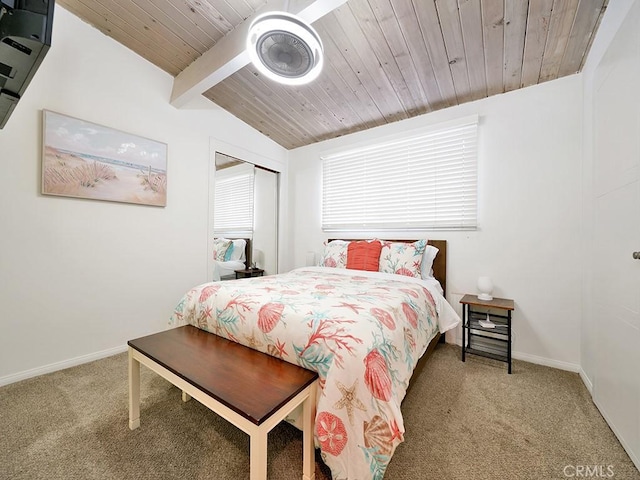 carpeted bedroom featuring vaulted ceiling with beams, a closet, and wooden ceiling