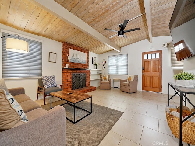 tiled living room featuring wooden ceiling, vaulted ceiling with beams, a brick fireplace, and ceiling fan