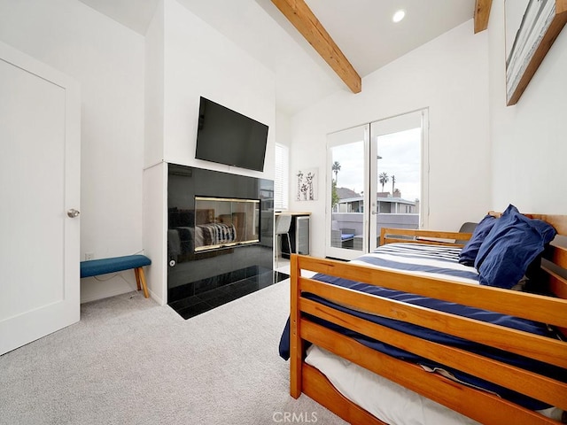 bedroom featuring carpet floors and lofted ceiling with beams