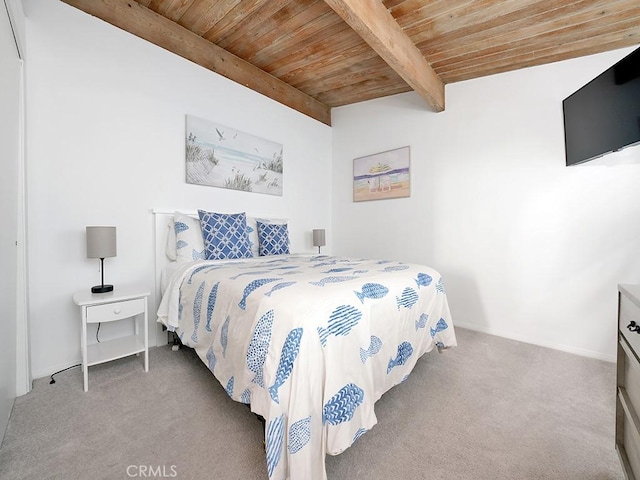 bedroom featuring light carpet, beamed ceiling, and wooden ceiling