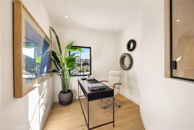 home office featuring light hardwood / wood-style floors