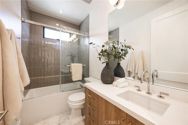 full bathroom with vanity, combined bath / shower with glass door, and toilet