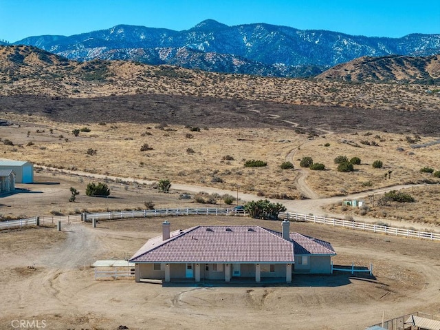 bird's eye view featuring a rural view and a mountain view