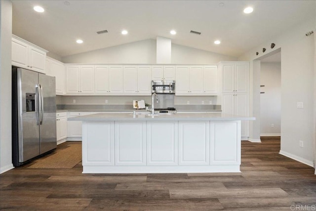 kitchen featuring white cabinetry, a center island with sink, stainless steel appliances, dark hardwood / wood-style floors, and sink