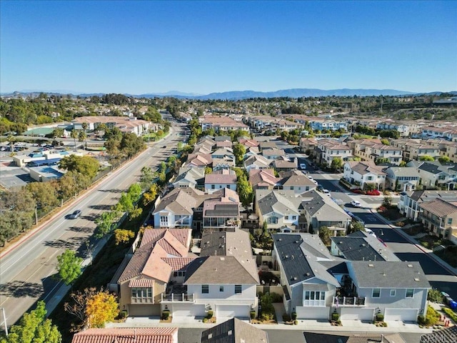 birds eye view of property with a mountain view