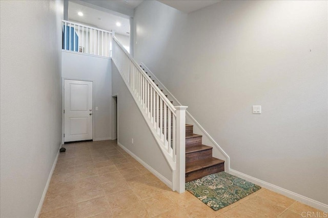 stairway featuring tile patterned floors