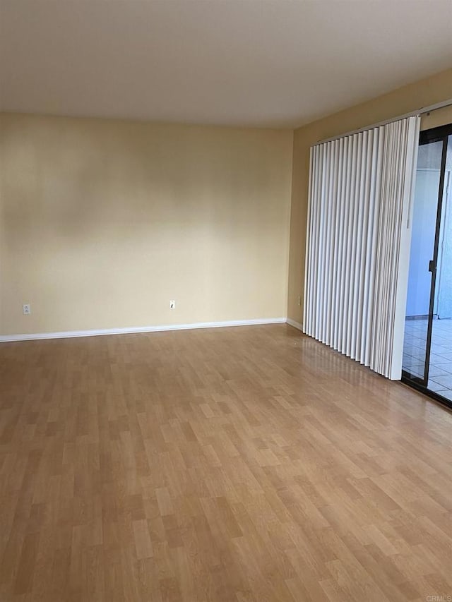 unfurnished room with light hardwood / wood-style flooring