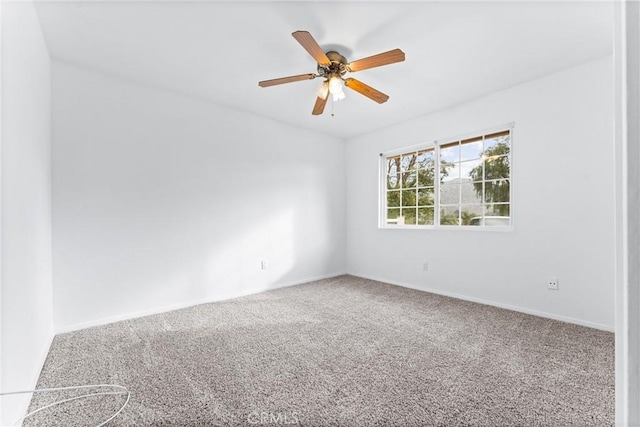 empty room with carpet floors and ceiling fan