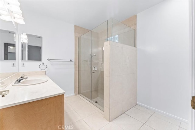 bathroom featuring vanity, tile patterned floors, and an enclosed shower