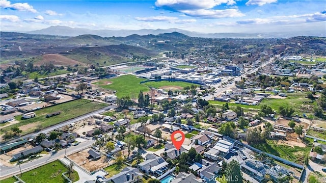 birds eye view of property with a mountain view