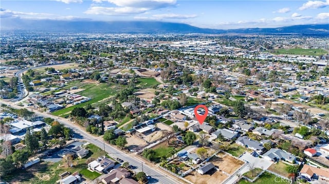 birds eye view of property with a mountain view