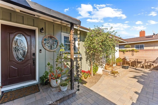 property entrance with a patio