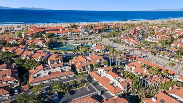 bird's eye view featuring a water view and a beach view