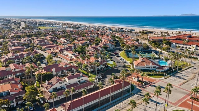 aerial view with a water view and a view of the beach