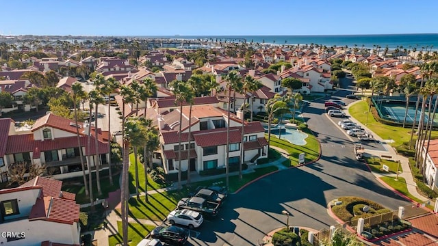 bird's eye view with a water view and a residential view