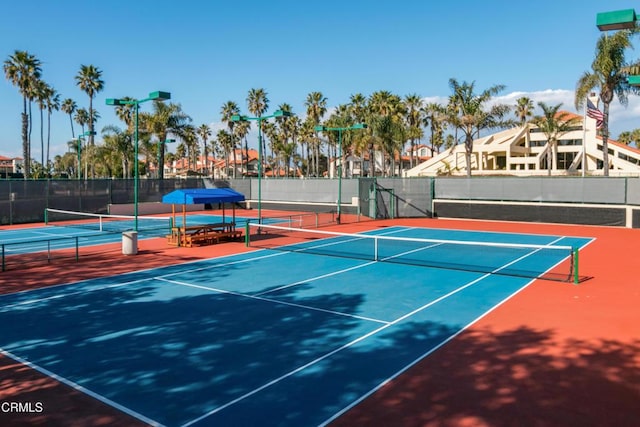 view of sport court featuring fence