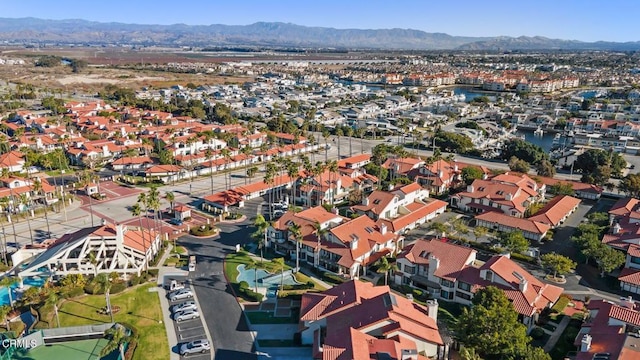 aerial view featuring a residential view and a water and mountain view