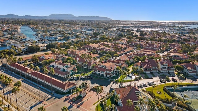 aerial view featuring a residential view and a water and mountain view