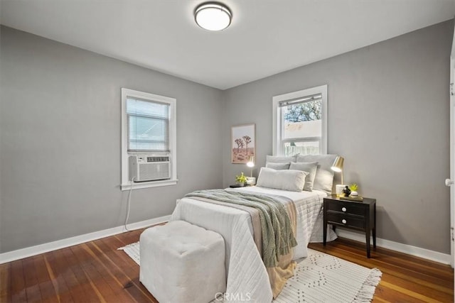 bedroom featuring hardwood / wood-style flooring and cooling unit