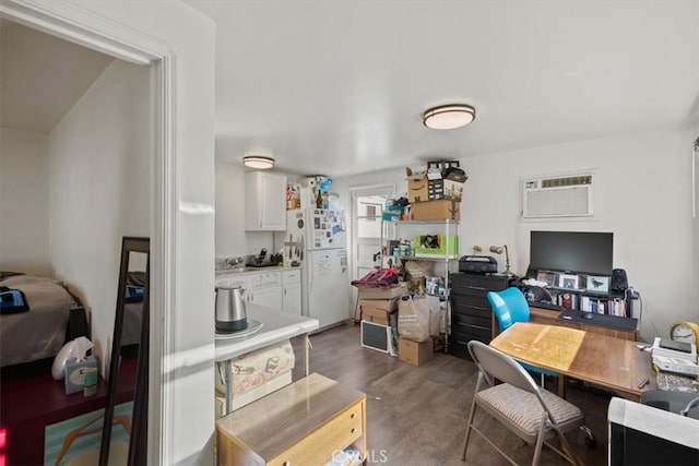 office featuring dark wood-type flooring and a wall unit AC