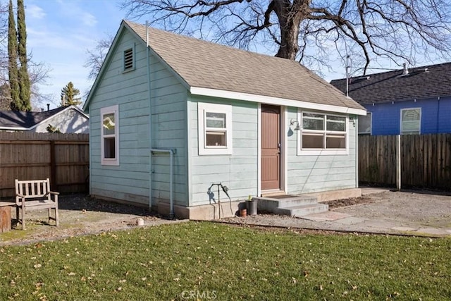 view of outbuilding featuring a yard