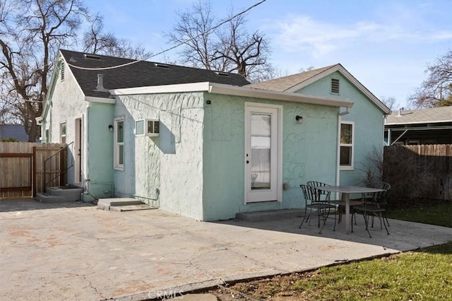 back of property featuring a patio area