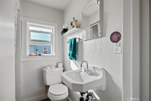 bathroom with toilet and sink