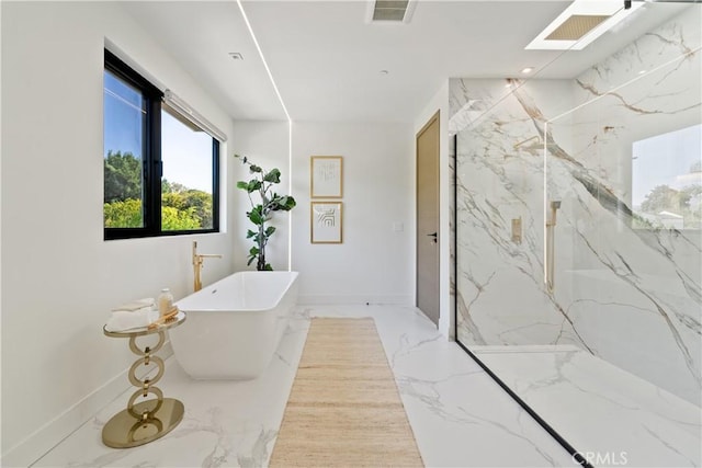 bathroom with a skylight and plus walk in shower