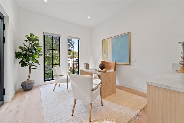 office with light hardwood / wood-style flooring